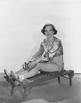 Stamina: Woman posing on rowing machine