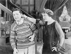 Tugging: Woman pulling a man's ear