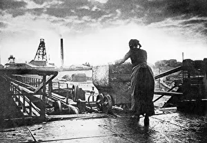Pushing: Woman pushing a skip from a mine, 1904