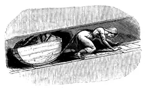 Dragging: Woman putter dragging sledge of coal along a
