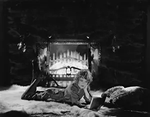 Cozy: Woman reading book by the fire
