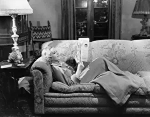 Literacy: Woman reading on couch