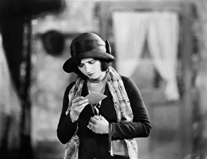 Frown: Woman reading upsetting note