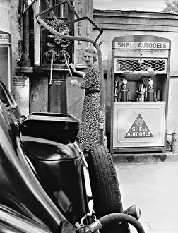Fills: A woman refueling, 1938