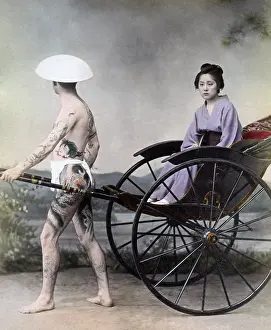 Attendant: Woman in a rickshaw with tattooed attendant, Japan circa 189