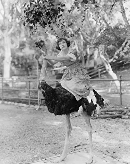 Irritated: Woman riding ostrich