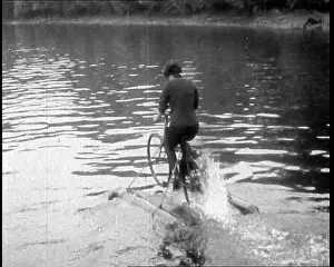 Contraption: Woman Riding Along A River on a Floating Bicycle