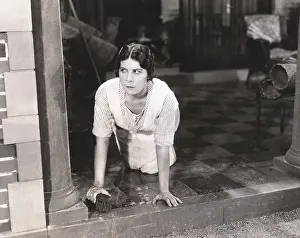Curiousity: Woman scrubbing the floor