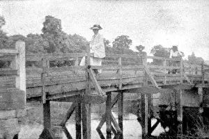 Bpeosa: Woman seated on bridge
