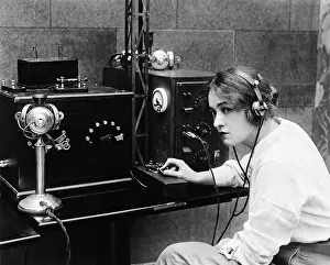 Telegraphs: Woman sending Morse code using telegraph
