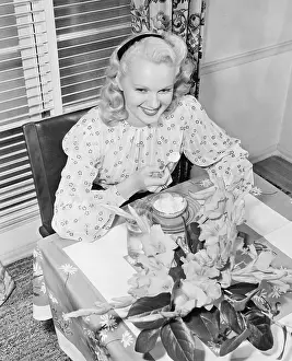Flirtatious: Woman sitting at a breakfast table