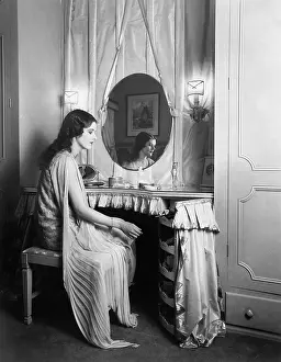 Long Haired: Woman sitting at her vanity table