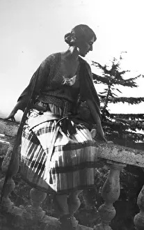 Frascati: A woman sitting on a wall