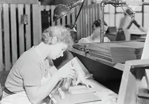 Workbench: Woman skillfully applying gold with an air