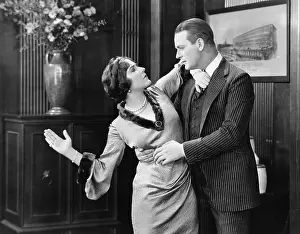Aggressiveness: Woman about to slap a man in the face