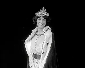 Imitation: A Woman Smiling at the Camera Against A Black