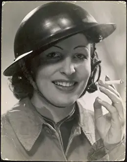 Nonchalantly: WOMAN SOLDIER SMOKING