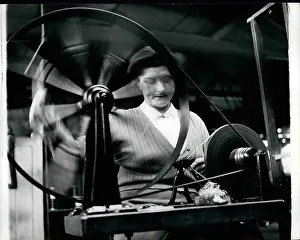 Threads: Woman at spinning wheel producing threads for Coronation