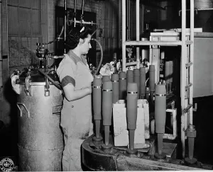 Ammunition: A woman sprays artillery shells with olive