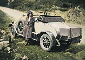 Verge: Woman standing in front of car