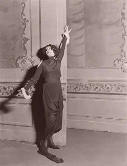 Ov1607: Woman standing in dramatic pose