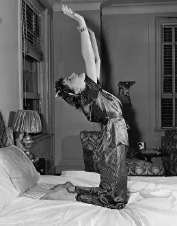 Pajamas: Woman stretching on bed