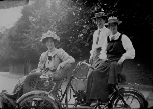 Bpeosa: Woman and students on motorised bicycle
