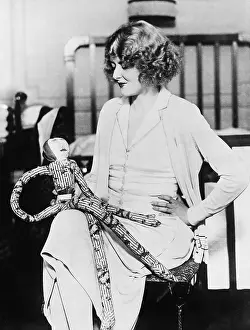 Rareness: Woman with a stuffed doll on her lap