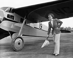 Tarmac: Woman in suit with plane