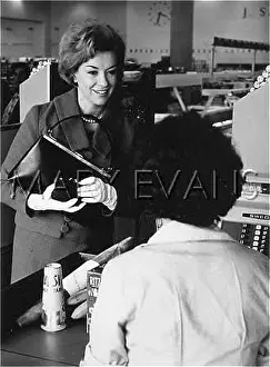 Checkout: WOMAN IN A SUPERMARKET