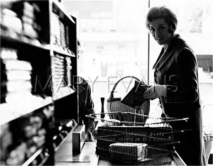 Checkout: WOMAN IN A SUPERMARKET