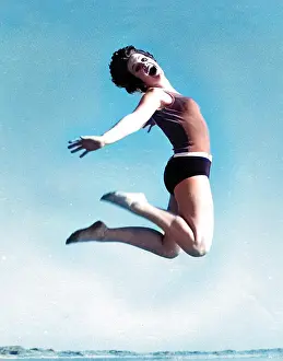 Andrew Besley: Woman in swimsuit jumping