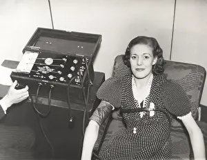 Ov1606: Woman taking a polygraph test