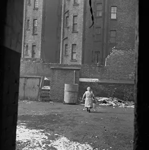 Outbuildings: Woman Taking Out Rubbish