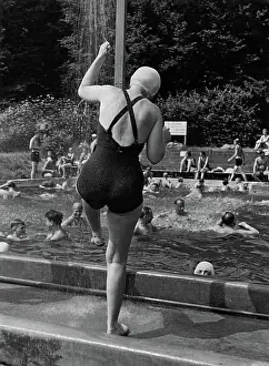 Showers: A woman is taking a shower
