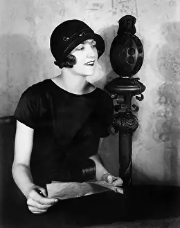 Mics: Woman talking into a microphone