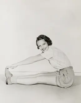 Beneficial: Woman touching her toes