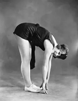 Workout: Woman touching toes
