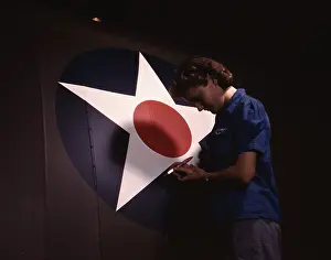 Fuselage: A woman touching up the U.S. Army Air Forces
