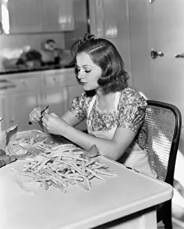 Nutritious: Woman trimming beans