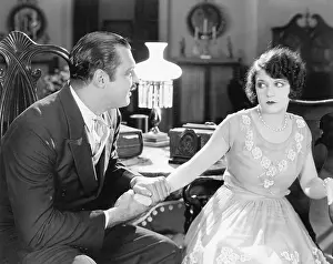 Everett Collection (old Visuals): Woman trying to pull away from a man