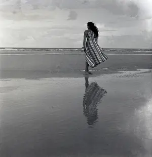 A Flying History - Peter Keating Aviation Collection: Woman on a twilight beach
