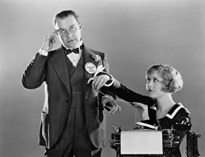 Preventative: Woman tying string round a man's finger to remember