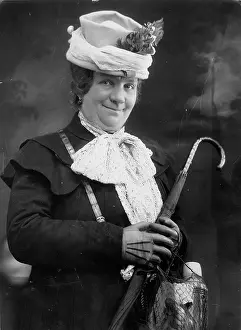 Cranky: Woman with umbrella and string bag