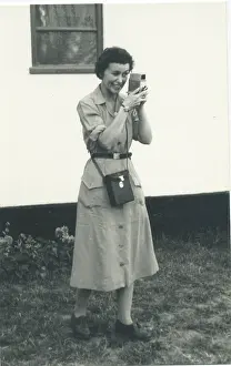 Jan21: Woman using a cine camera