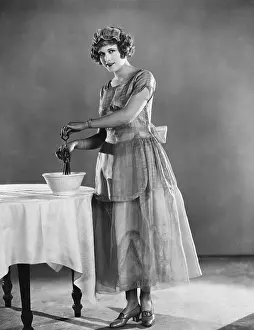 Timid: Woman using eggbeater