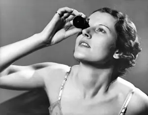 Nightdress: WOMAN USING EYE BATH