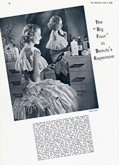 Bottles: Woman using a powder puff at her dressing table 1935