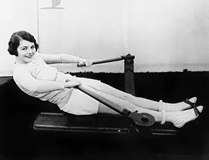 Rower: Woman using rowing machine