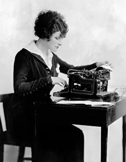 Businesswoman: Woman using typewriter